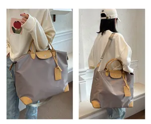 Stylish casual travel duffel bag with top handles, nylon material and durable leather trim.