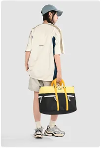 Color-blocked travel duffel bag with large capacity for sports, fitness and business trips.