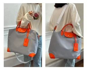 Stylish large capacity travel shoulder bag, grey and orange durable weekender tote for daily use.