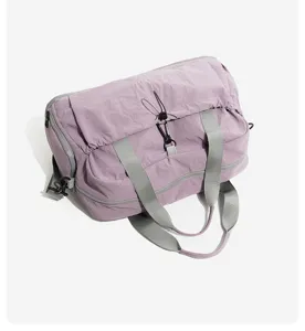 Large capacity travel duffel bag for gym and short trips, stylish purple canvas with grey straps.