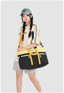 Detail view of the color-block travel duffel bag showing large capacity and straps.