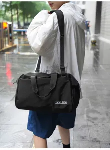 Large capacity travel duffel bag for short trips, waterproof and durable stylish black bag.