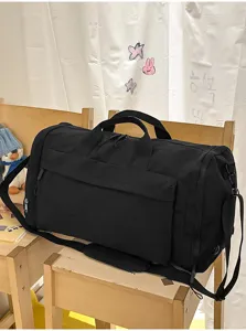 Black large capacity travel duffel bag gym overnight bag with shoulder strap for sports.