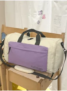 Large capacity duffel bag detail view, showing sturdy handles, zipper pocket and portable design.