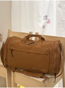 Large capacity travel duffel bag for short trips, portable fitness gym bag with strap.