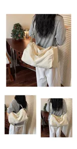 Detail view of the large capacity travel canvas duffel bag, showing shoulder strap and compartments.