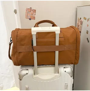 Large capacity travel duffel bag with trolley sleeve, perfect for short trips and fitness.