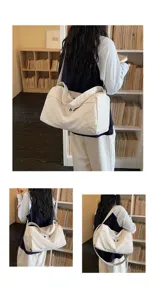 Large capacity white canvas travel duffel bag with shoulder strap for short trips and fitness.