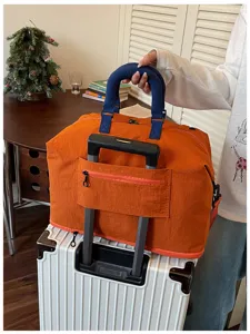 Large travel duffel bag with trolley sleeve, lightweight waterproof weekender bag for gym and trips.