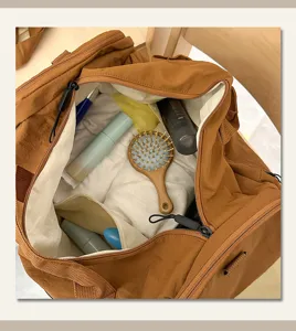 Detailed view of large capacity travel duffel bag interior, showcasing dry wet separation storage.