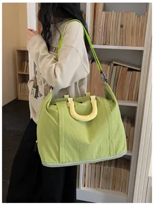 Large capacity travel duffel bag with dry wet separation and comfortable shoulder strap for gym.