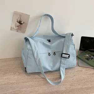 Light blue travel duffel bag large capacity gym bag waterproof weekend overnight bag for travel.