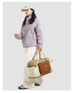 Colorblock nylon travel duffel bag with wet dry separation for hiking camping and sports use.