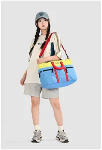 Color-block travel duffel bag, large capacity gym bag and lightweight sports luggage for trips.