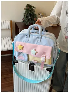 Details view of pastel travel duffel bag with cute plush star patches and large capacity.