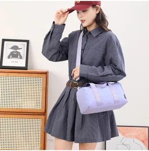 Small outdoor sports fitness bag, water-repellent casual cylinder design for yoga travel.