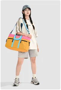 Color-blocked travel duffel bag with large capacity, ideal for gym, sports and weekend trips.