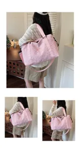 Detailed view of large capacity pink travel duffel bag with star print for gym and outdoor.
