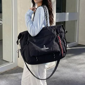 Large capacity casual black travel duffel bag for short trips, lightweight and stylish.