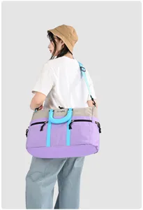 Spacious color-block travel bag for weekend trips, lightweight fitness and gym duffel.
