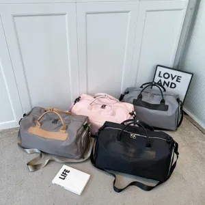 Large capacity travel duffel bag with separate shoe compartment and wet pocket for gym and sports.