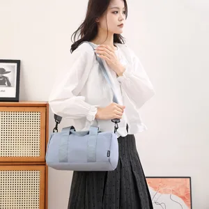 Casual light blue cylindrical sports duffel bag for fitness, yoga, and short travel.
