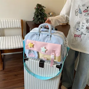 Chic color-block women's travel duffel bag with cute plush star decorations, large capacity.