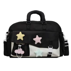 Stylish black and white canvas shoulder bag with cute plush star decorations for daily use.
