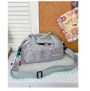 Waterproof outdoor sports duffel bag for travel, gym, and casual daily use in gray color.