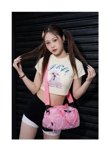 Detailed view of the stylish pink sports duffel bag with convenient strap and front drawstring.