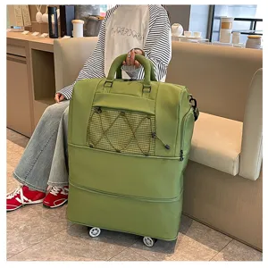 Green large capacity travel rolling luggage bag with wet dry separation and expandable design.