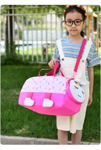 Close-up detail of pink unicorn kids travel duffel bag showcasing waterproof fabric and cute design.