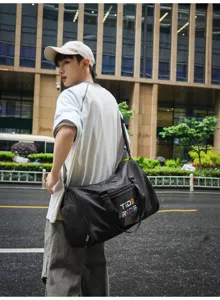 Stylish black gym duffel bag for sports, fitness and short travel with comfortable shoulder strap.