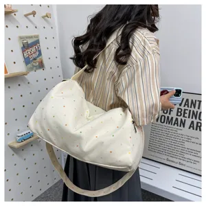 Detail view of the cute polka dot casual travel duffel bag, showing soft texture and spacious design.