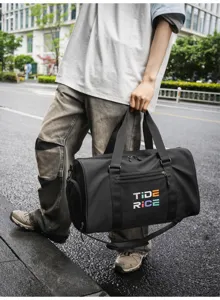 Stylish black fitness duffel bag with spacious design for travel and sports training use.