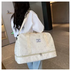 Detailed view of large travel duffel bag with star pattern, dry wet separation compartment.