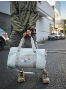 Trendy light blue gym duffel bag with dry wet separation, ideal for travel and sports fitness.