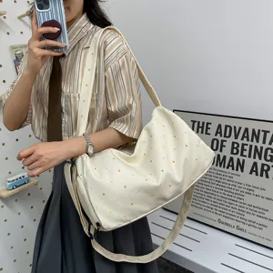 Casual canvas shoulder bag with colorful polka dots, large capacity travel duffel for daily use.