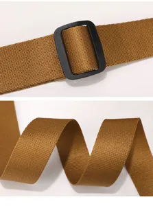 Close-up detail of bag strap, durable brown nylon webbing with black plastic buckle.