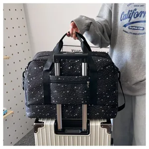 Travel duffel bag with trolley sleeve, black star pattern, large capacity for gym or trips.