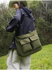 Large capacity canvas shoulder bag, casual outdoor travel crossbody bag with multi pockets.