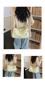 Detail view of casual canvas messenger bag showing shoulder strap and zipper pocket.