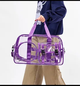 Transparent purple gym travel bag detail showing clear PVC material and sturdy woven straps.