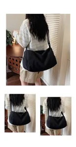 Lightweight black travel duffel bag large capacity casual crossbody fitness shoulder bag detail view.