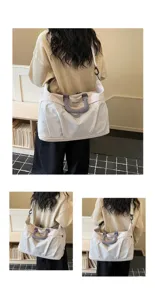 Detailed view of the large capacity travel gym bag with mesh texture and sturdy handles.