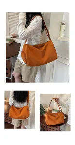 Detailed view of large capacity orange gym travel bag with adjustable strap for daily use.
