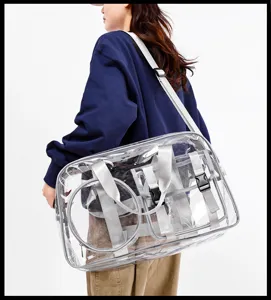 Clear PVC gym travel bag detail shot showing straps, buckles, and large capacity style.