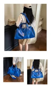 Blue gym duffel bag for sports travel, large capacity waterproof training bag with strap.