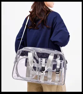 Clear PVC travel gym bag with silver straps, waterproof swimming beach bag for outdoor use.