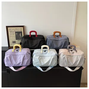 Large capacity travel duffel bag for short trips, gym and sports fitness use in multi colors.